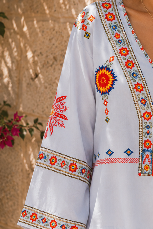 Lumina Wear Penelope bohemian embroidered summer blouse with V-neck and floral details, lightweight and stylish for warm weather.
