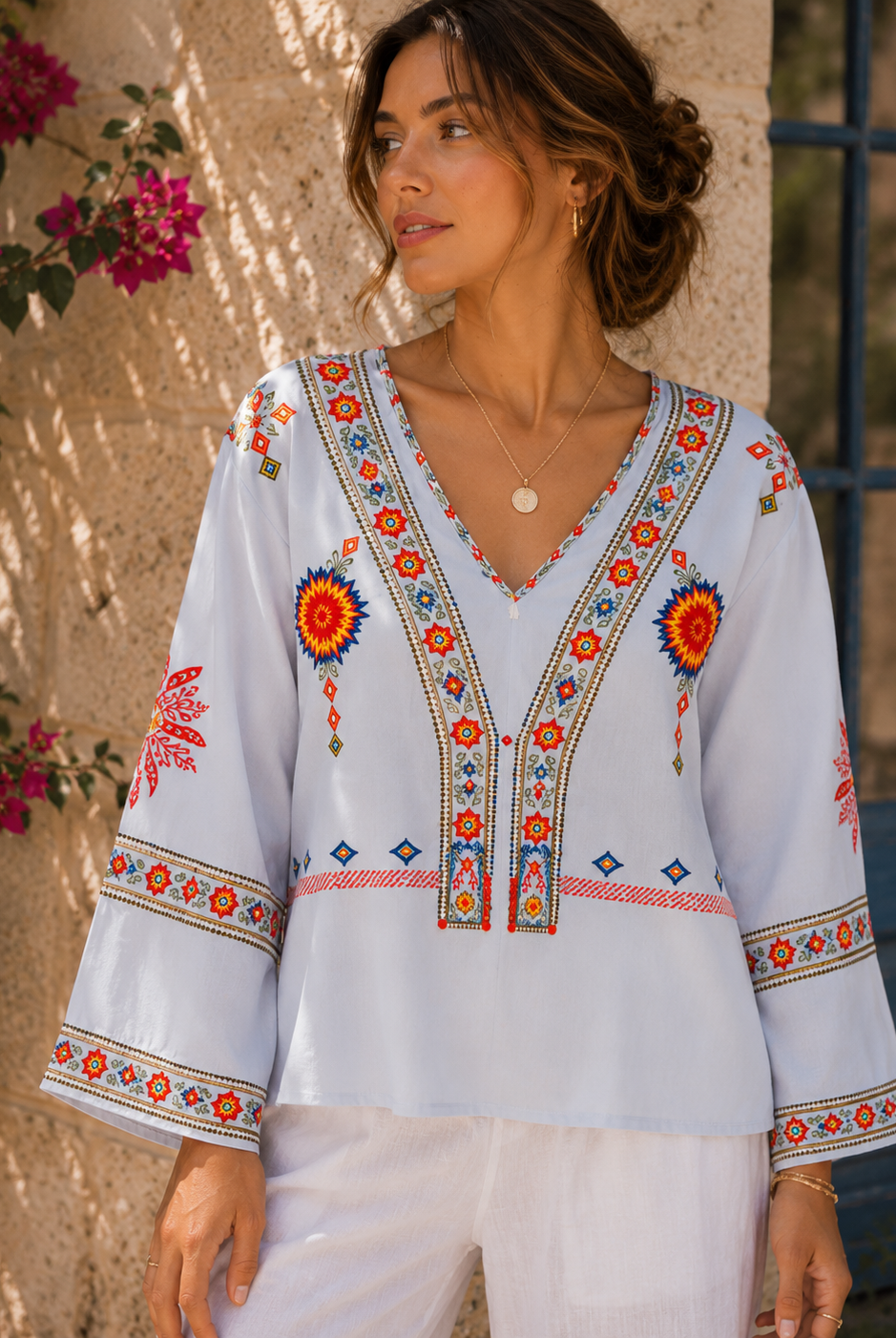 Lumina Wear Penelope bohemian embroidered summer blouse with V-neck, featuring colorful floral embroidery and lightweight fabric.
