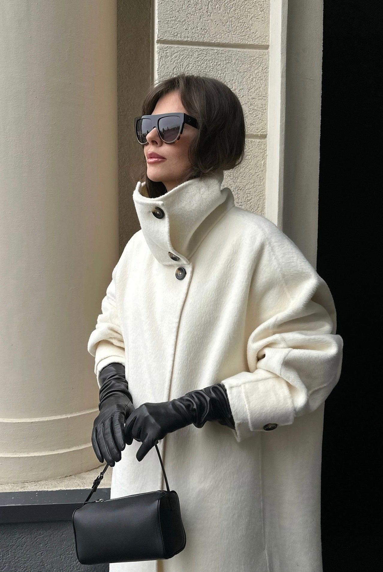 Elegant structured longline coat with high-neck design by Lumina Wear, featuring a sophisticated silhouette and tailored fit.