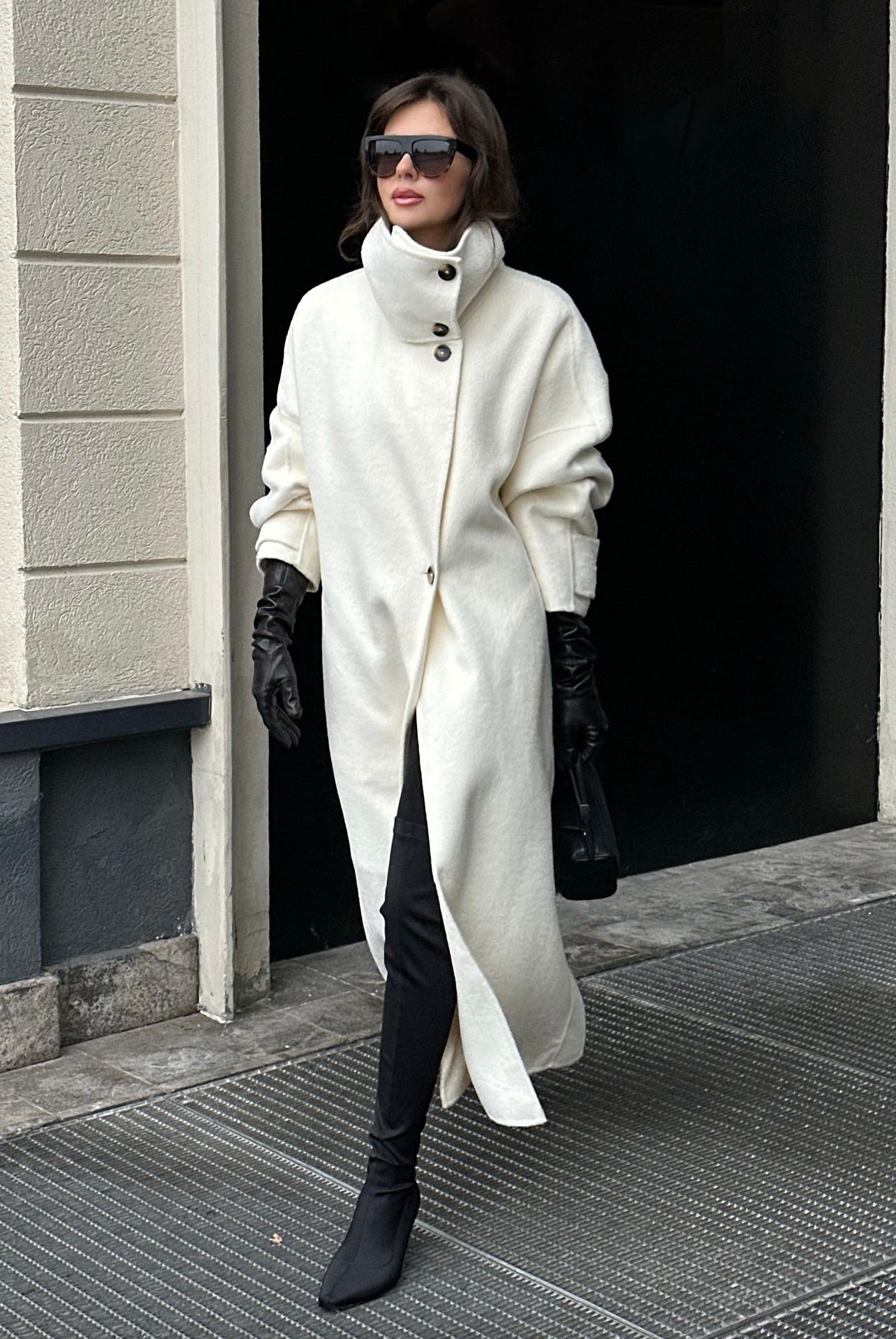 Elegant Lumina Wear Amaya longline coat with structured design and high-neck detail, stylish outerwear for sophisticated winter looks.
