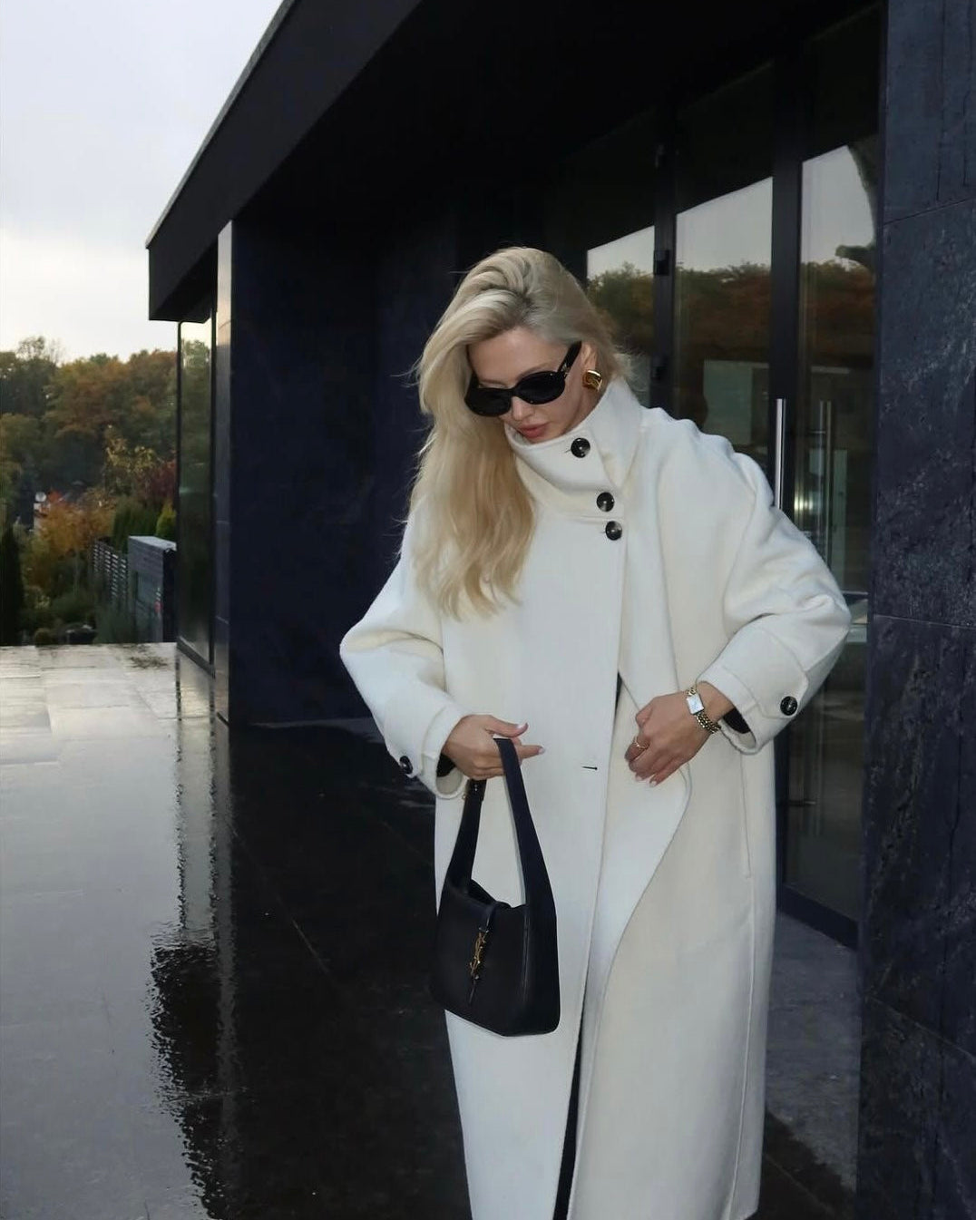 Elegant structured longline coat with high-neck design by Lumina Wear, featuring a sophisticated silhouette and tailored details.