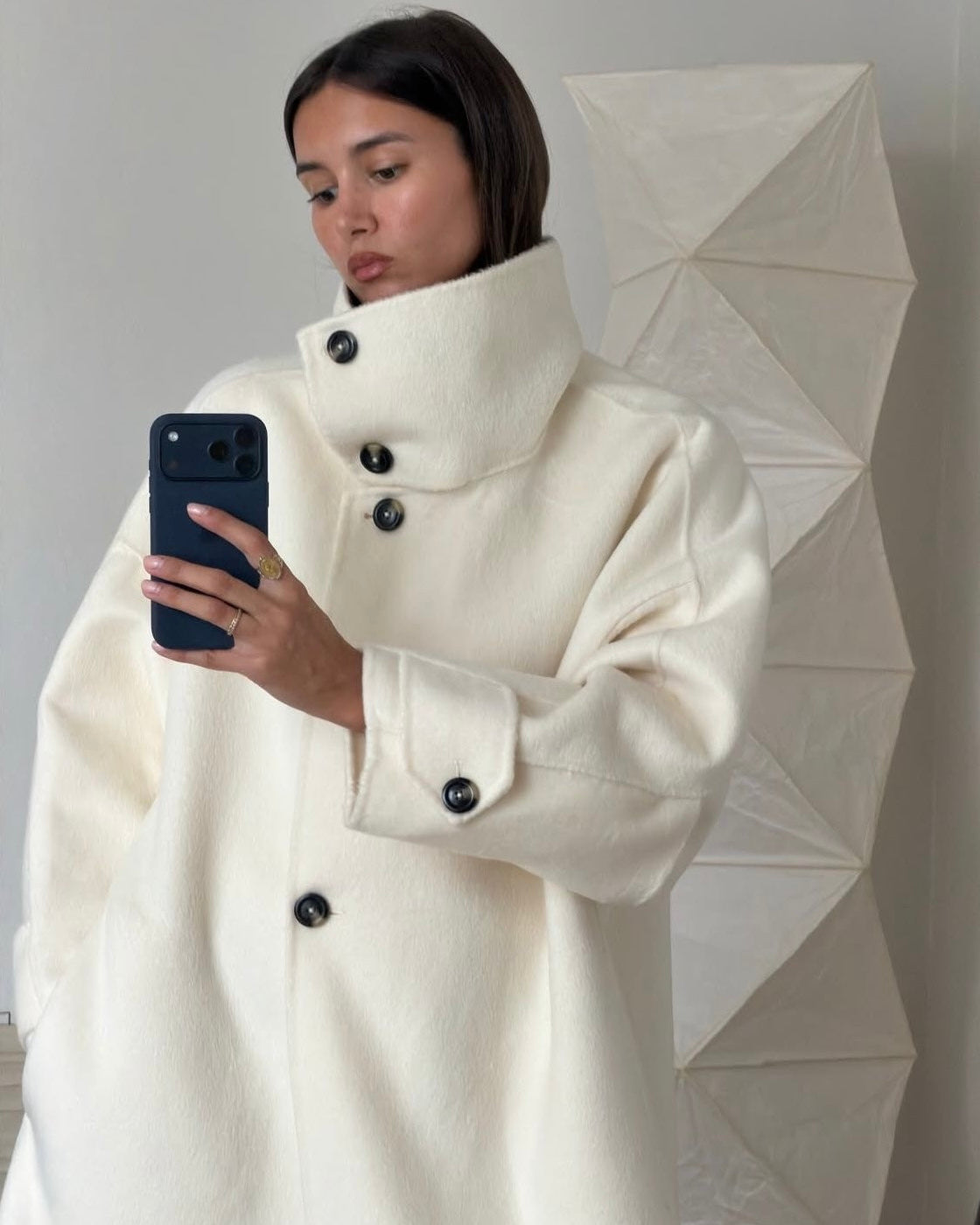 Lumina Wear Amaya longline coat with high-neck design, structured fit, and elegant style, shown in a sophisticated outerwear image.