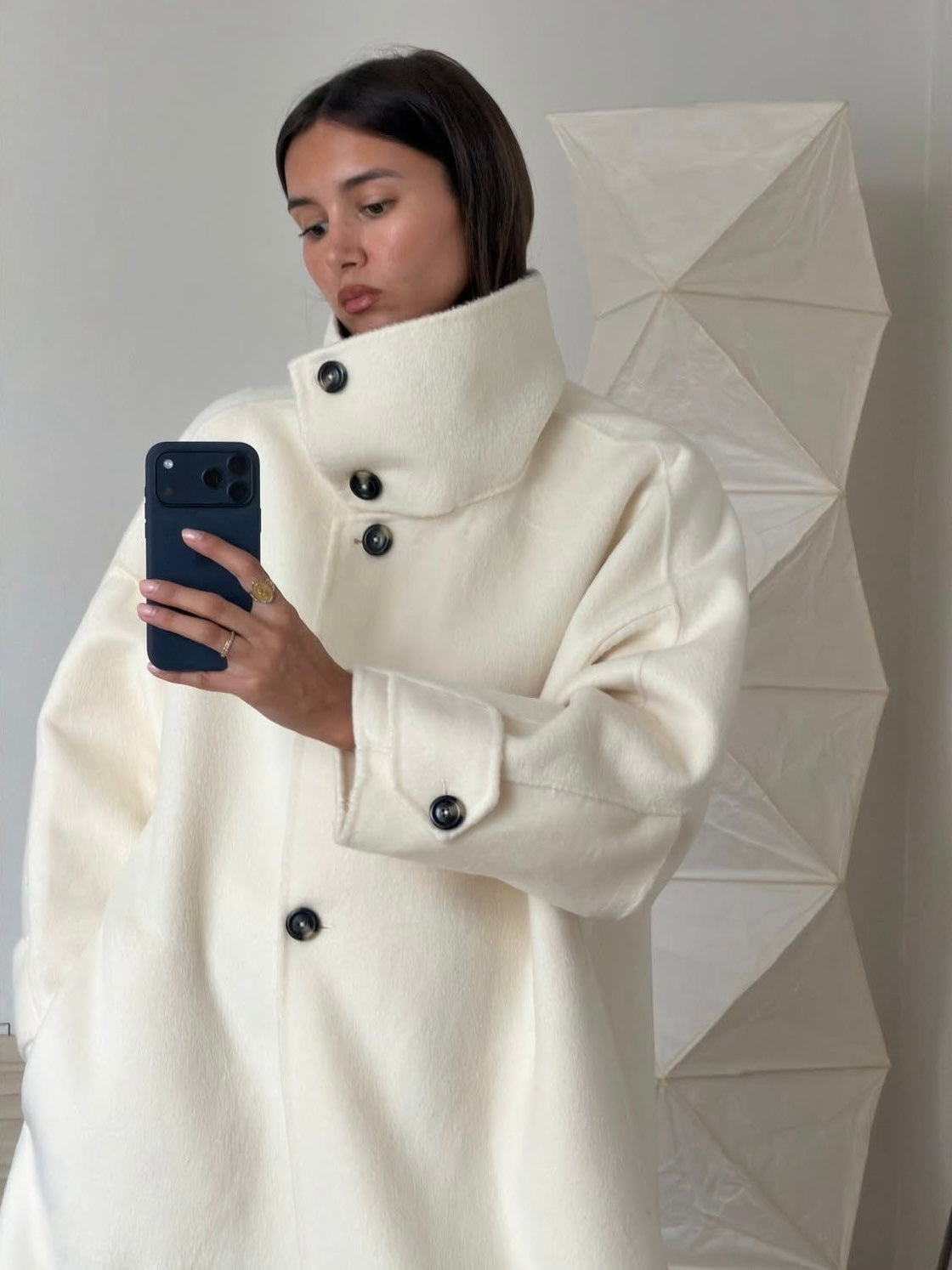 Elegant Lumina Wear Amaya longline coat with structured design and high-neck style, displayed on a mannequin.