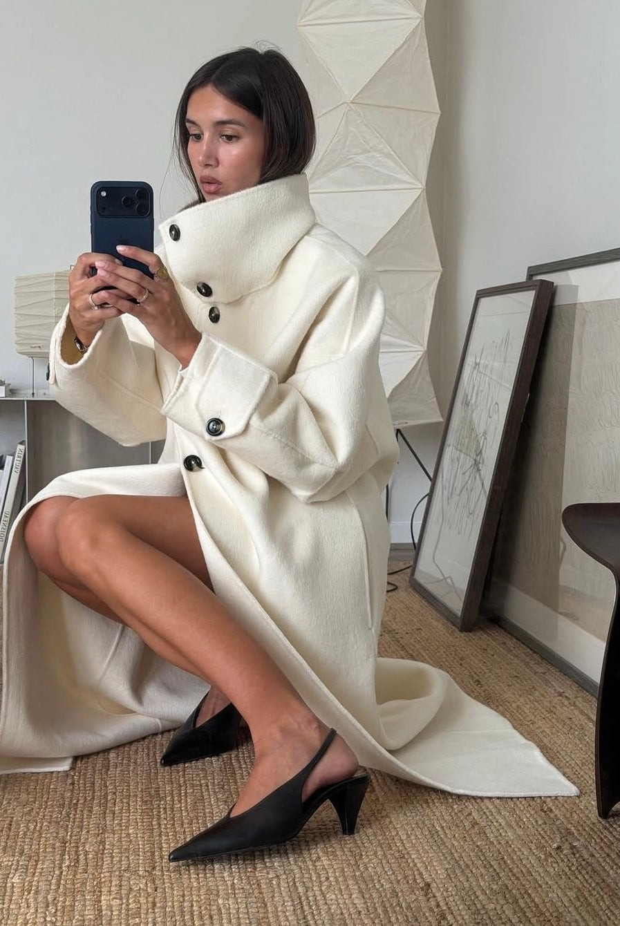 Elegant structured Lumina Wear Amaya longline coat with high-neck design, tailored for a sophisticated winter look.