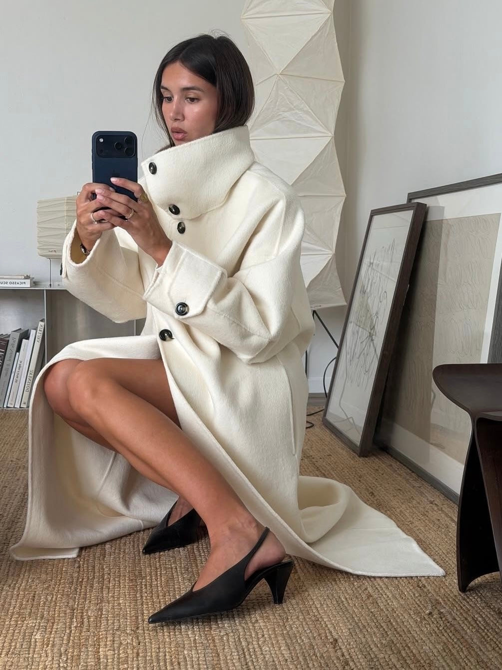 Elegant structured Lumina Wear Amaya longline coat with high-neck design, tailored for a sophisticated winter look.
