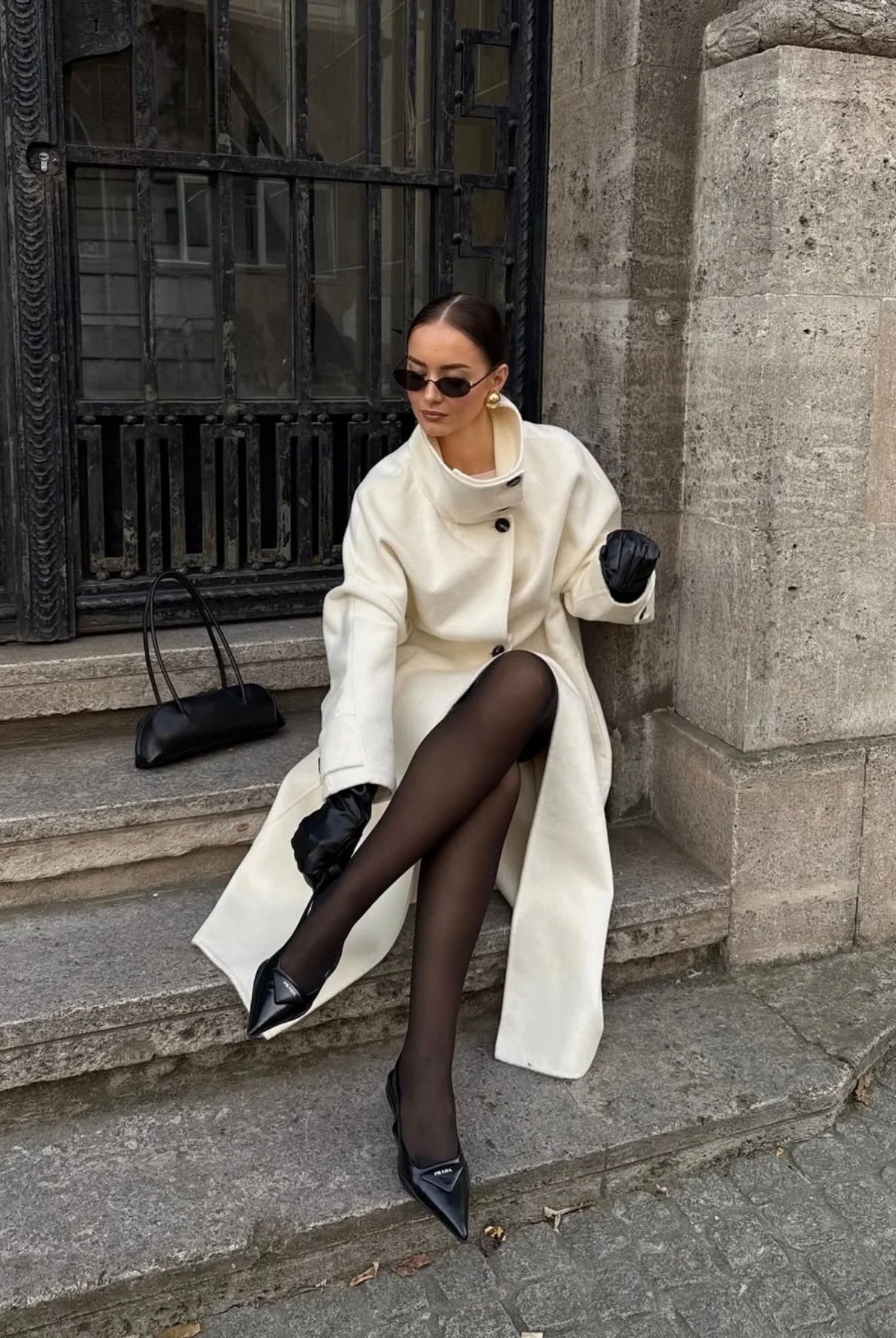 Lumina Wear Amaya longline coat with elegant structured design and high-neck style, perfect for sophisticated winter wear.