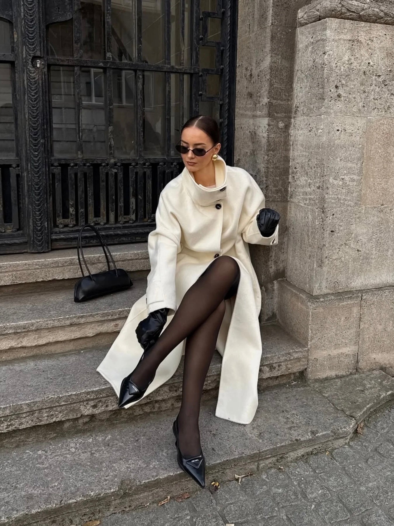 Lumina Wear Amaya longline coat with elegant structured design and high-neck style, perfect for sophisticated winter wear.
