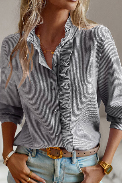 Lumina Wear Ariana elegant ruffled button blouse with versatile styling, featuring a feminine ruffle design and classic button details.