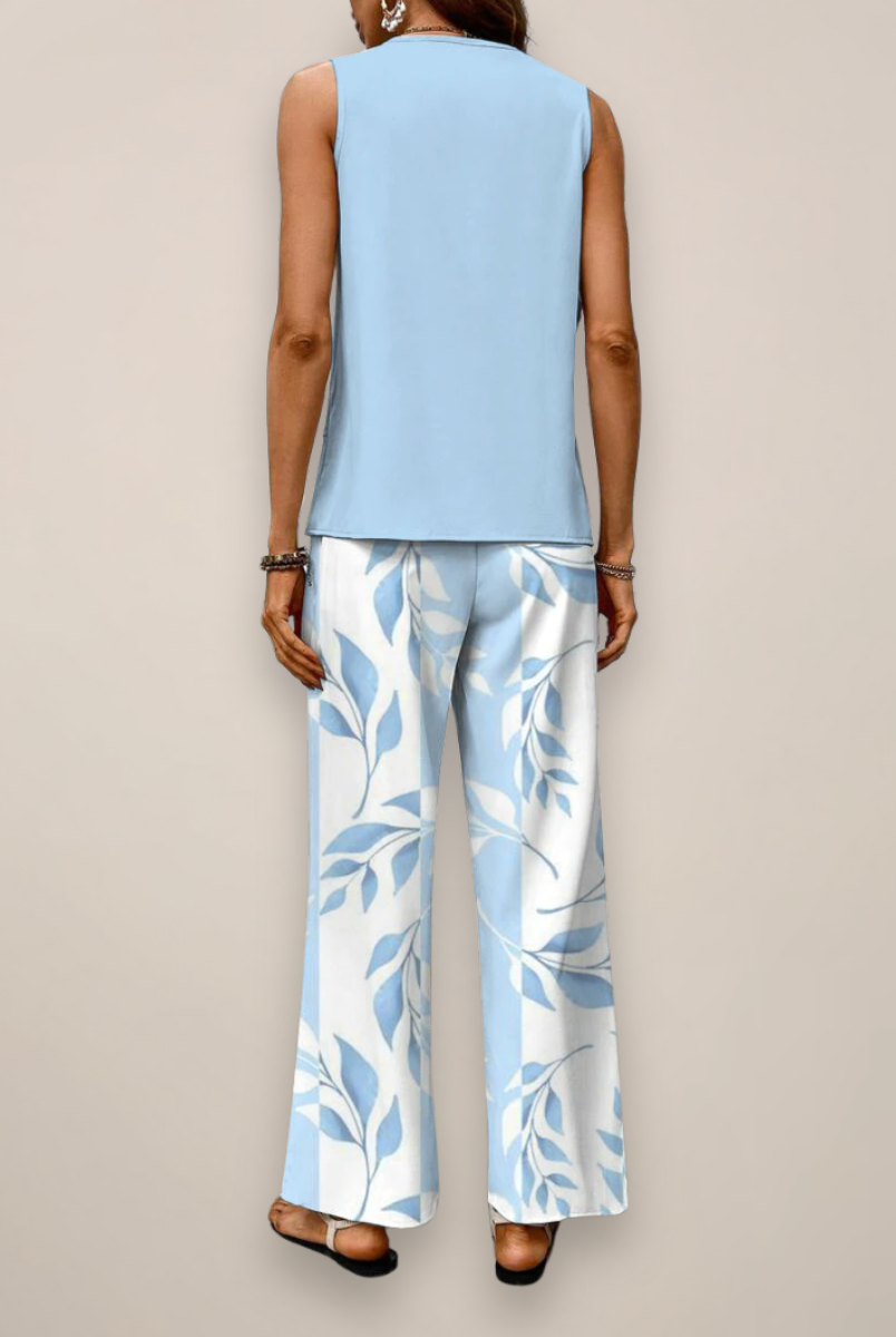 A woman wearing the Lumina Wear Ava vibrant printed wide-leg set with relaxed fit, showcasing colorful patterns and comfortable style.