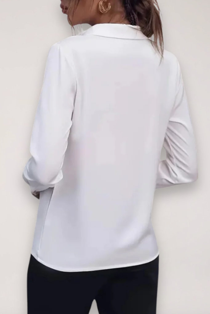 Elegant tailored white women's blouse by Lumina Wear featuring button-up front and classic collar, perfect for professional or casual wear.