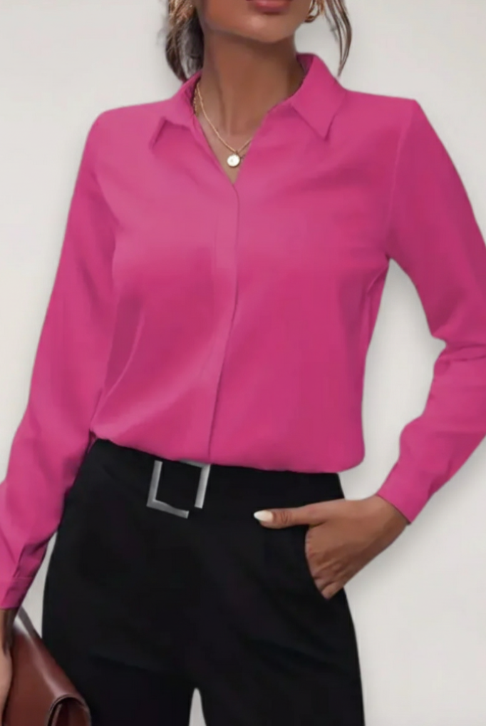 Elegant tailored white women's blouse by Lumina Wear featuring button-up front and classic collar, styled for professional or casual wear.
