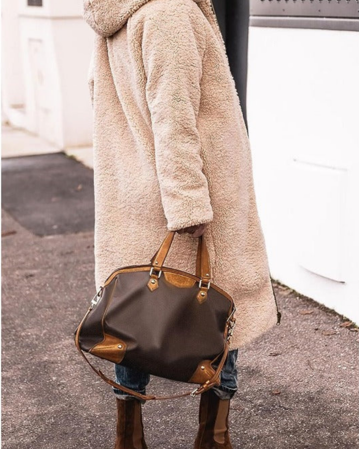 Elegant Lumina Wear Carina reversible long winter coat for women, showcasing cozy warmth and stylish design in a winter setting.