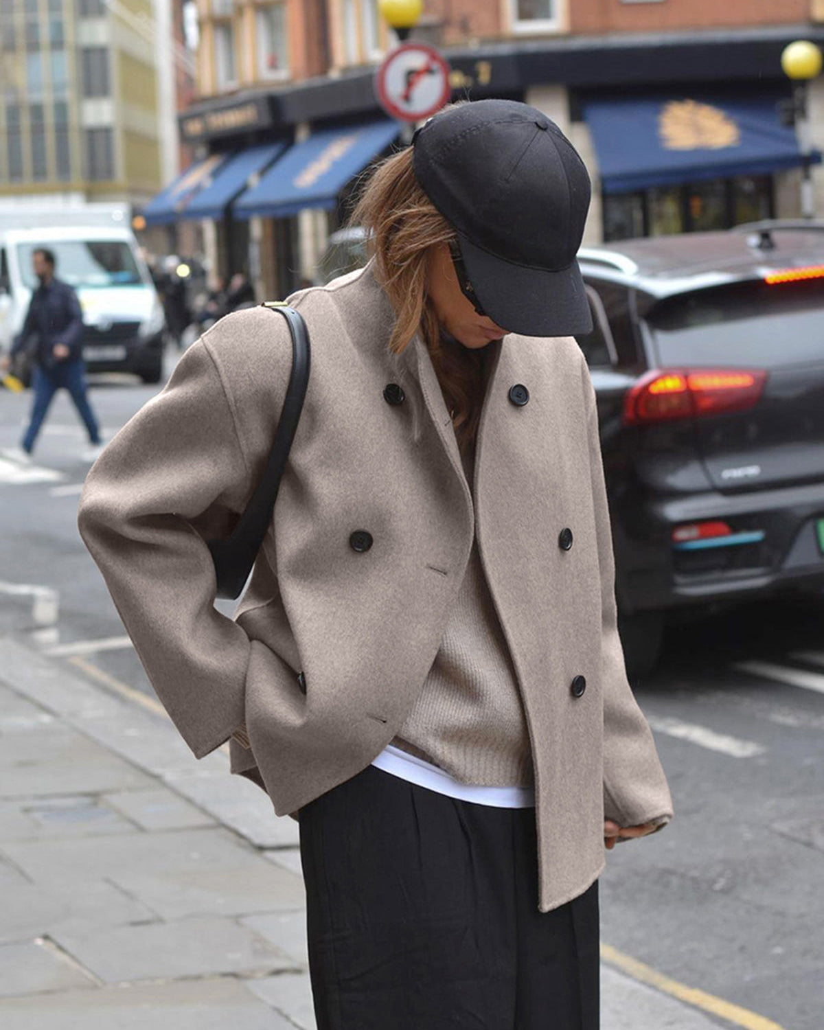 Black Charlene Lumina Wear double-breasted peacoat with stand collar, tailored coat with button details and stylish fit.