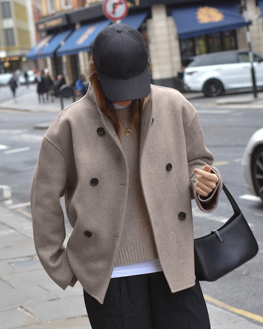 Black Charlene double-breasted peacoat with stand collar by Lumina Wear, stylish coat with tailored fit and classic design.