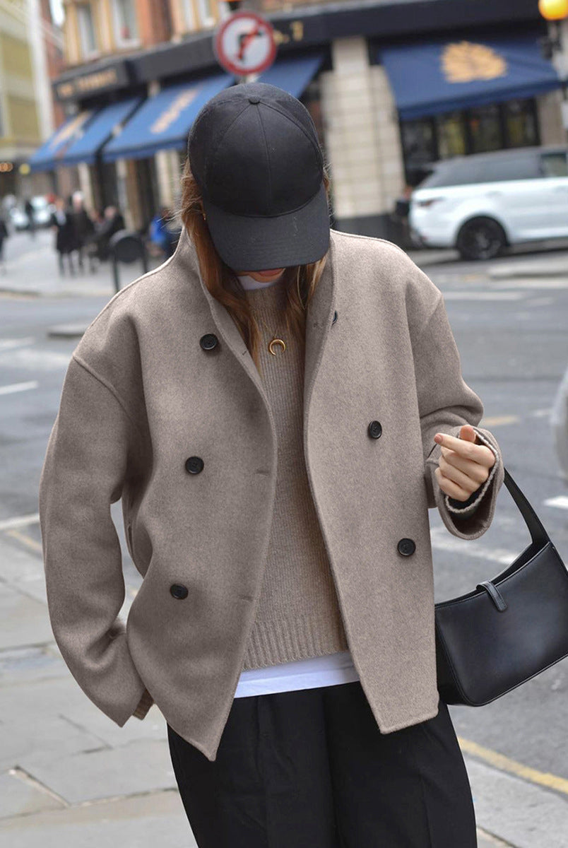 Black Charlene double-breasted peacoat with stand collar by Lumina Wear, showcasing classic style and tailored fit.