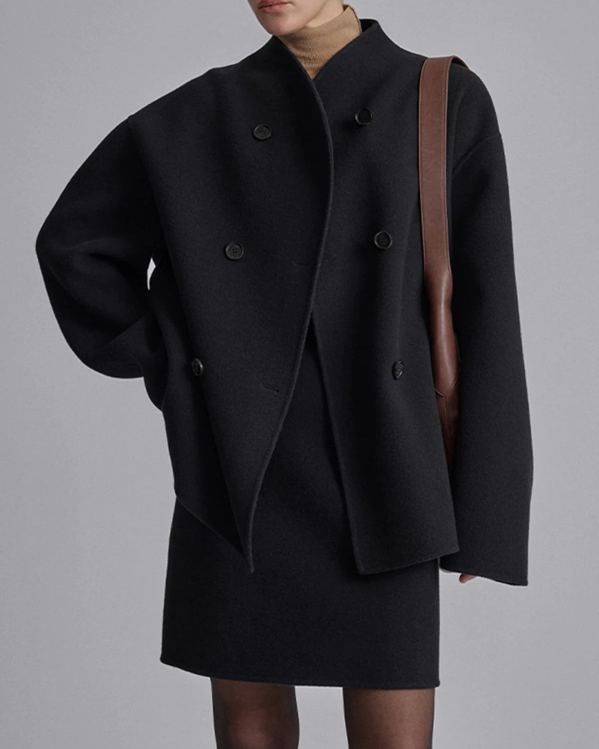 Charlene black double-breasted peacoat with stand collar by Lumina Wear, featuring tailored fit and classic style.