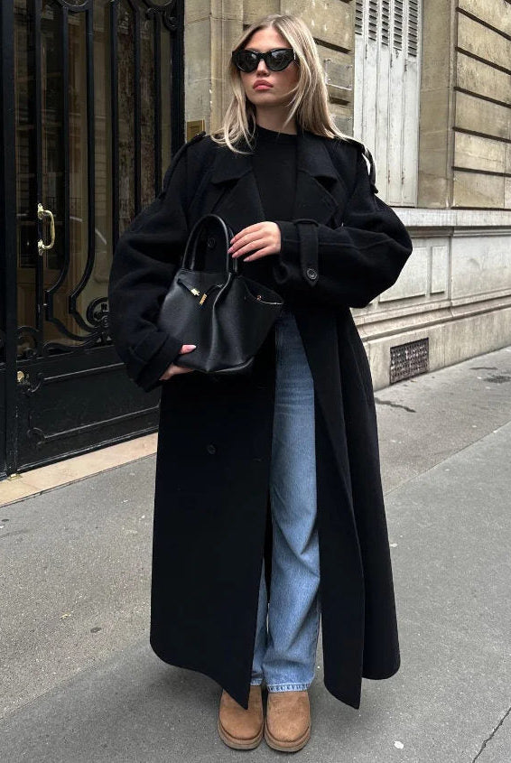 Black double-breasted trench coat with belted waist from Lumina Wear, featuring classic style and tailored fit.