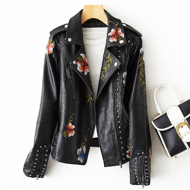 Women's leather jacket by Lumina Wear featuring edgy floral embroidery and silver studs, stylish and bold for modern fashion.