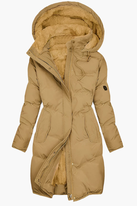 Women's quilted winter coat with hood and tailored fit by Lumina Wear, featuring elegant stitching and cozy design.