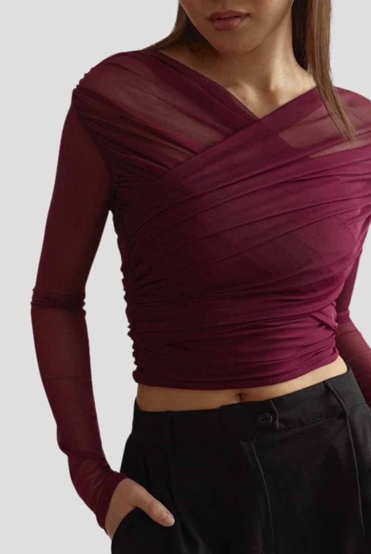 Lumina Wear Claire elegant sheer wrap top featuring a flattering fit, styled with long sleeves and a stylish neckline.