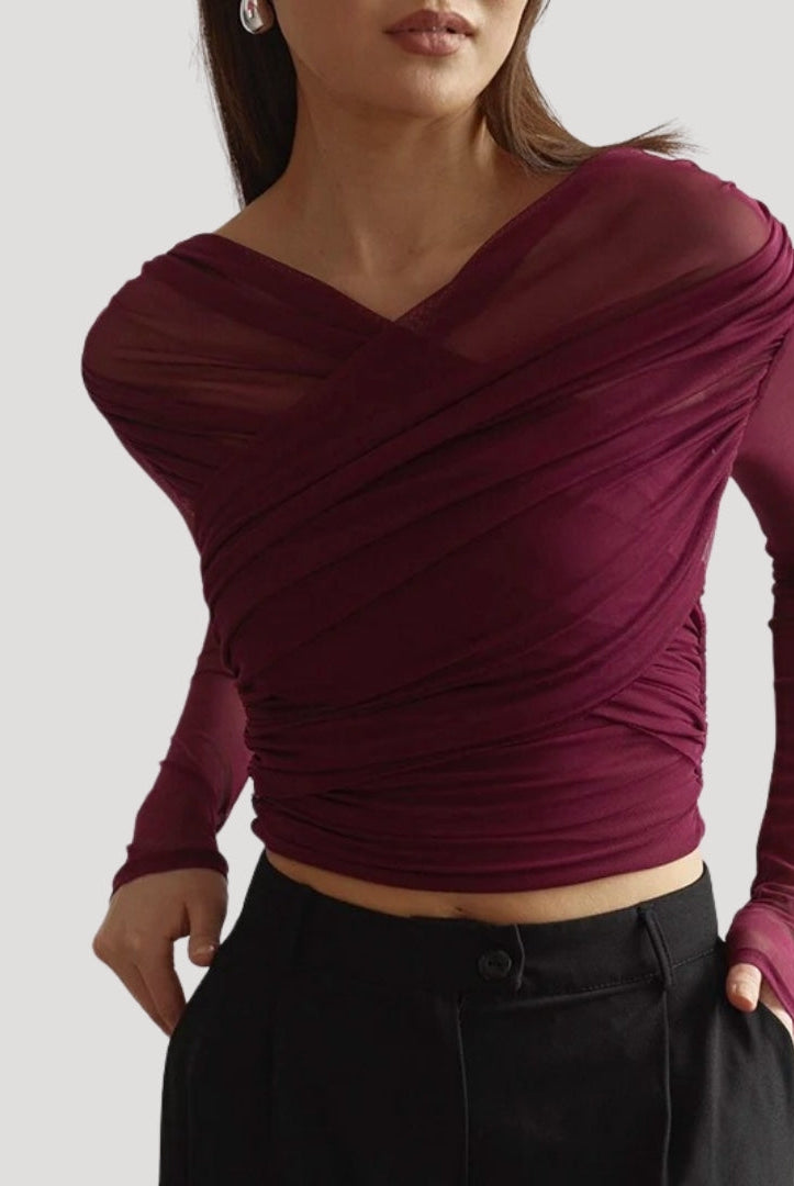 Elegant sheer wrap blouse by Lumina Wear featuring a flattering fit, styled with long sleeves and a sophisticated design.
