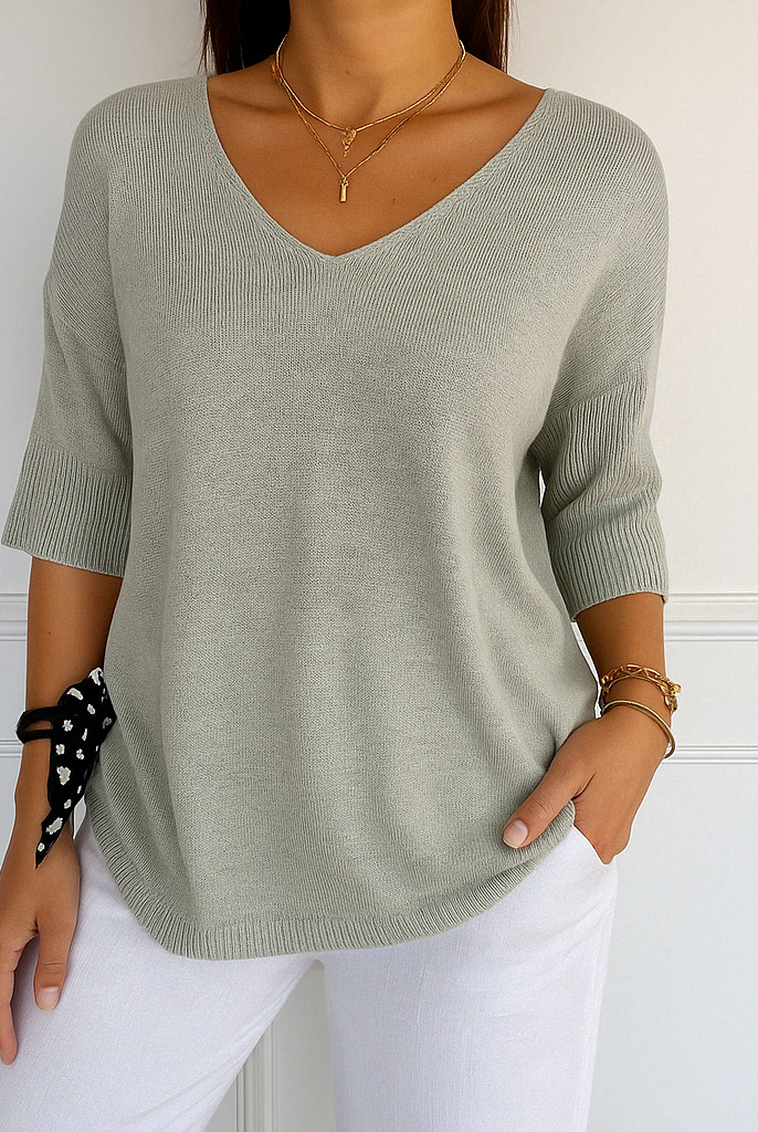 Light gray Lumina Wear Clara relaxed V-neck women's sweater with minimalist design, soft knit fabric and casual fit.