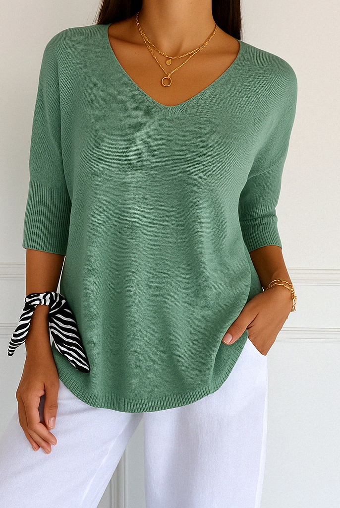 Light gray Lumina Wear Clara relaxed V-neck sweater with minimalist design, soft knit fabric, and comfortable fit for women.