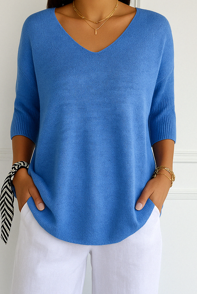 Light gray Lumina Wear Clara relaxed V-neck women's sweater with minimalist design, soft knit fabric, and comfortable fit.