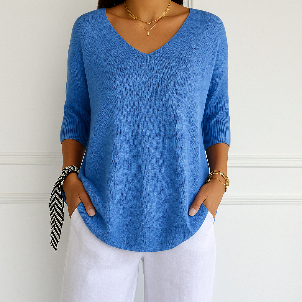 Light gray Lumina Wear Clara relaxed V-neck women's sweater with minimalist design, soft knit fabric, and comfortable fit.