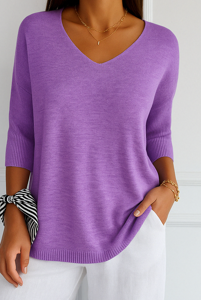 Lumina Wear Clara women's relaxed V-neck sweater with minimalist design, soft knit fabric, and casual fit.