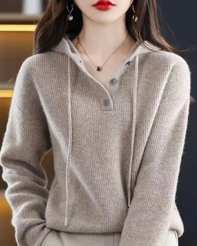 Lumina Wear Elise cozy v-neck hooded sweater with button details, soft knit fabric, and relaxed fit in a warm, neutral color.