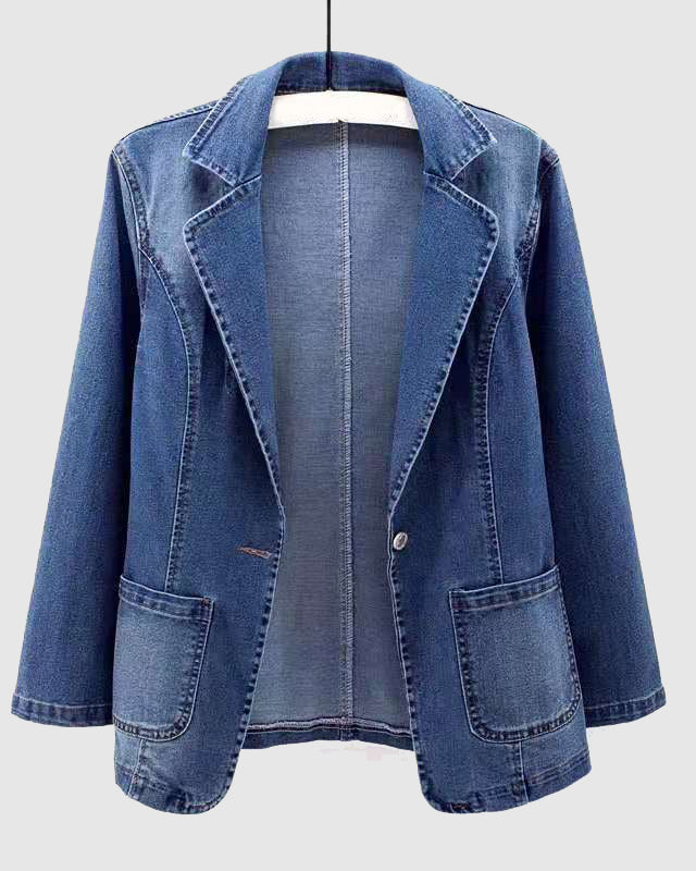 Light wash denim jacket by Lumina Wear featuring an elegant profile and stylish fit, shown on a model in a casual setting.
