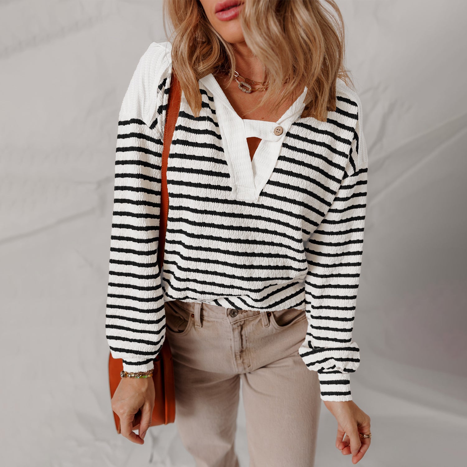 Lumina Wear Elise soft striped textured V-neck sweater with buttoned strap, cozy knit sweater for casual wear.