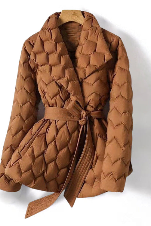 Lumina Wear Elise tailored geometric down puffer jacket with belted waist, featuring a modern design and quilted texture.