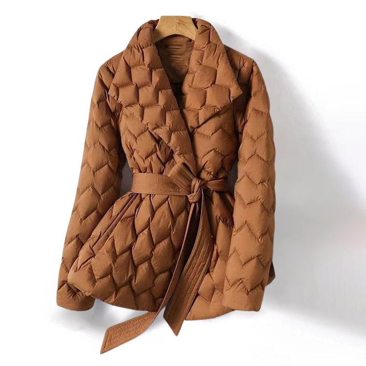 Lumina Wear Elise tailored geometric down puffer jacket with belted waist, featuring a modern design and quilted texture.