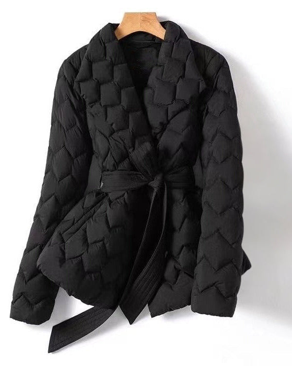 Lumina Wear Elise tailored geometric down puffer jacket with belted waist, featuring a sleek, structured design and warm filling.