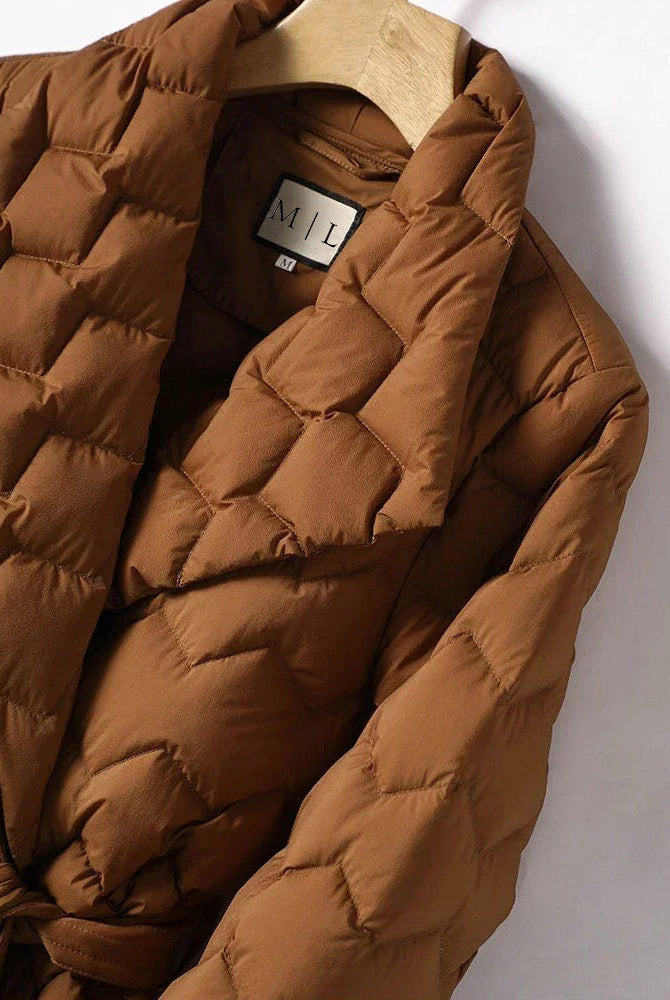 Lumina Wear Elise geometric down puffer jacket with belted waist, tailored fit, and quilted design, suitable for cold weather.