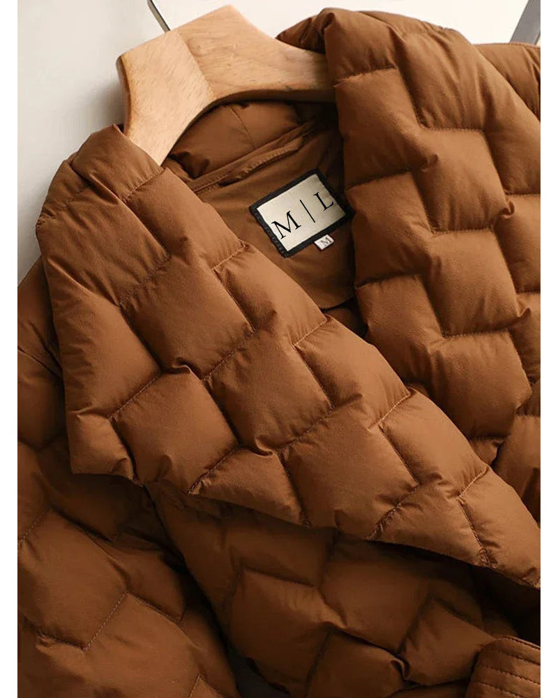 Lumina Wear Elise tailored geometric down puffer jacket with belted waist, shown in a close-up of the stylish design.