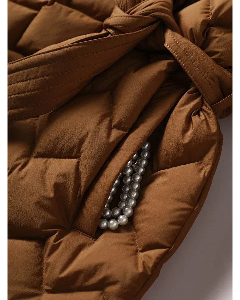 Lumina Wear Elise tailored geometric down puffer jacket with belted waist, plush insulated design, and stylish silhouette.