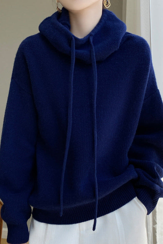 Lumina Wear Elise ultra-soft merino wool sweater with relaxed fit and tailored hood, shown in a cozy, stylish fit.
