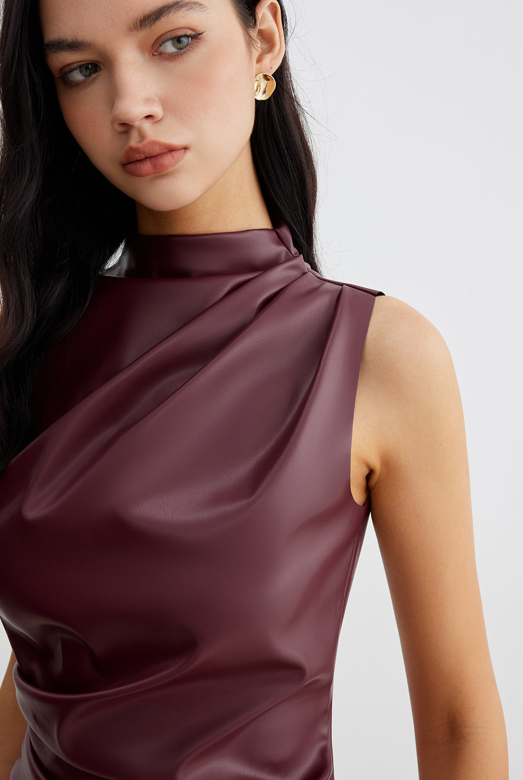 Chic sleeveless high-neck tank top for women from Lumina Wear, featuring a fitted design and smooth fabric in a stylish cut.
