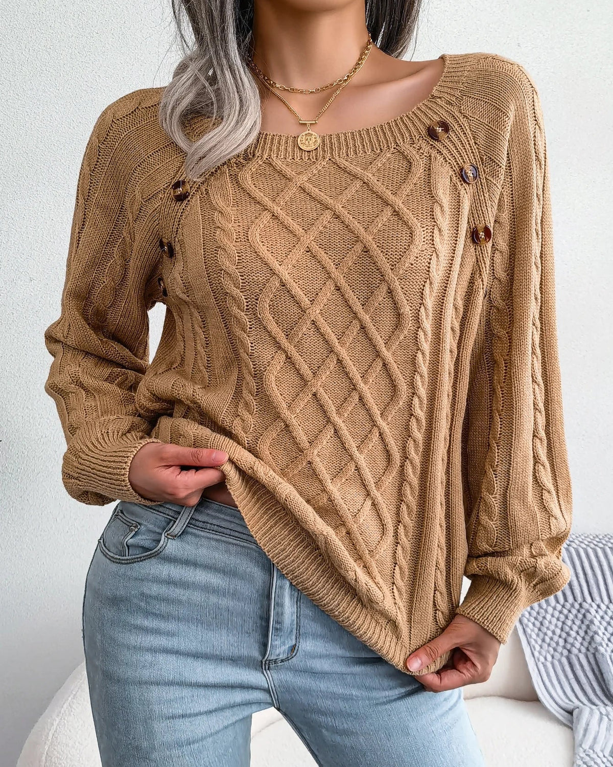 Lumina Wear Emilia cozy cable-knit women's sweater with relaxed fit and button accents, perfect for comfortable casual wear.