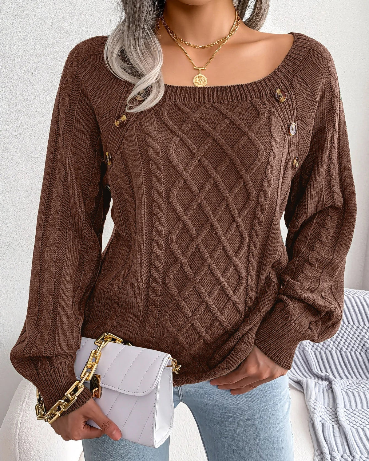 Lumina Wear Emilia cozy cable-knit women's sweater with relaxed fit and button accents, perfect for casual winter wear.