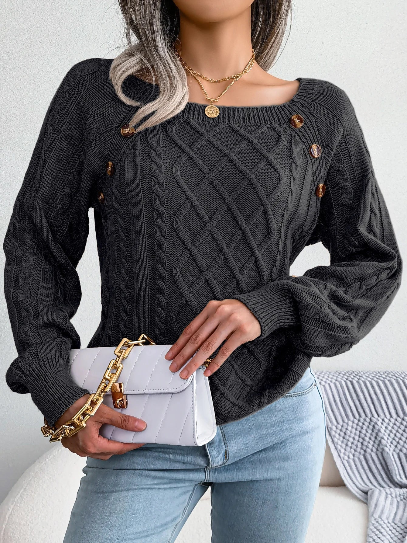 Emilia Lumina cozy cable-knit relaxed fit women's sweater with button accents, shown in a soft, comfortable fit and stylish design.