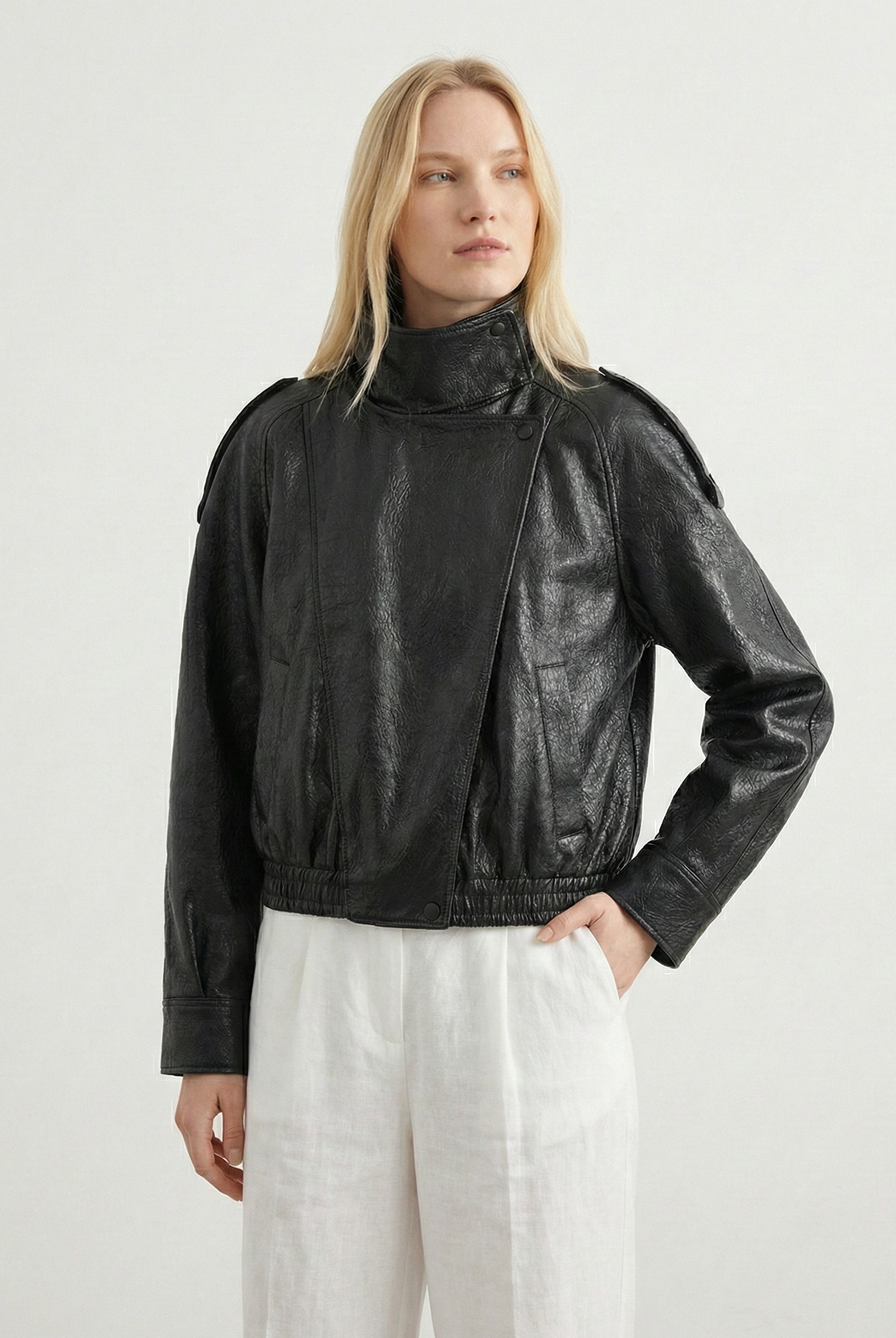 Women’s oversized structured high-neck faux leather jacket by Lumina Wear, featuring a sleek design and bold silhouette.