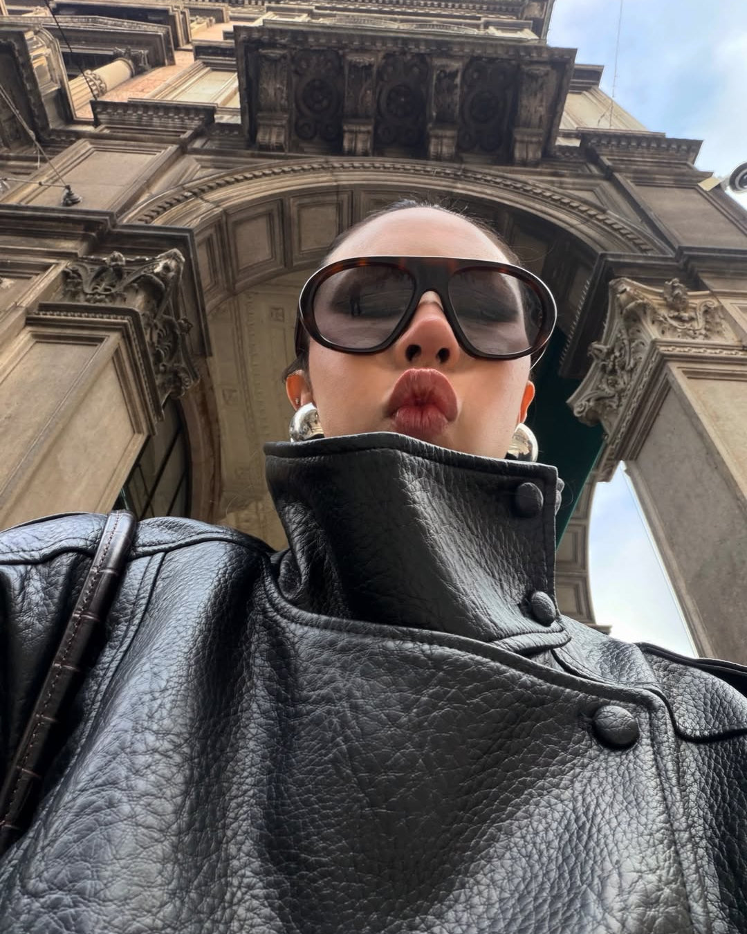 Lumina Wear Felicia oversized structured high-neck faux leather jacket displayed on a mannequin, showing its sleek design and bold silhouette.