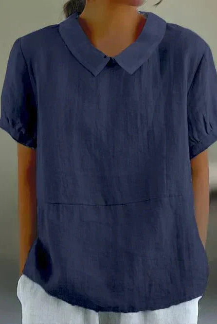 Linen blouse by Lumina Wear featuring a Peter Pan collar, in a charming, lightweight fabric perfect for casual or office wear.