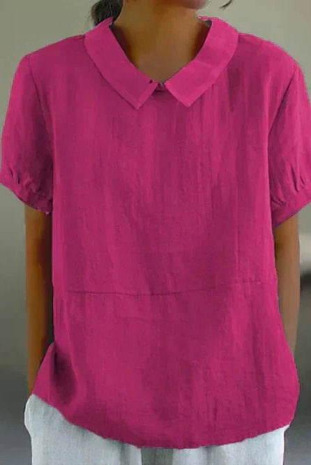 Linen blouse with Peter Pan collar from Lumina Wear, featuring a charming, lightweight design and soft fabric in a natural setting.