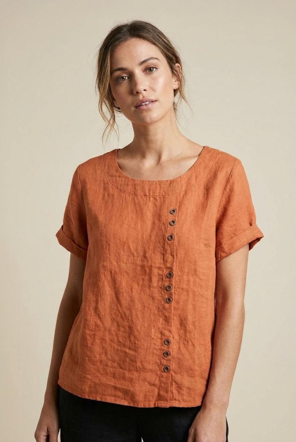 Light beige Lumina Wear Grace relaxed linen blouse with button detail, featuring a loose fit and casual style.