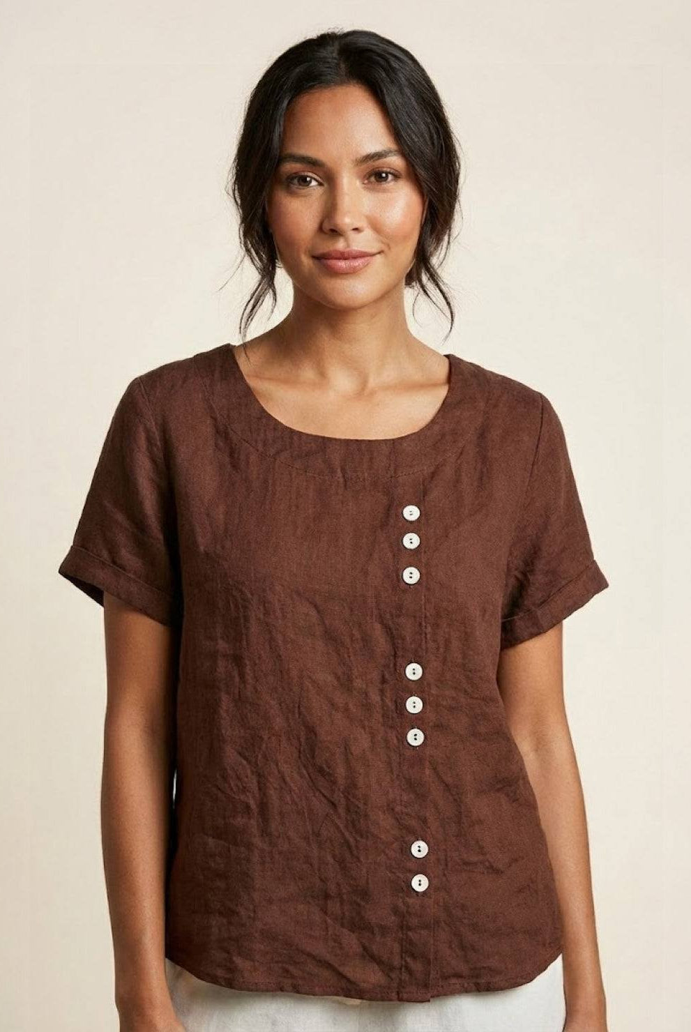 Light beige relaxed linen blouse with button details from Lumina Wear, featuring a casual fit and classic design.
